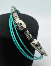 Load image into Gallery viewer, Teal Twin Skull Guitar String Bracelet
