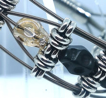 Load image into Gallery viewer, Glass Skull Guitar String Bracelet
